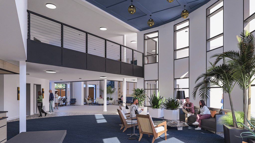 A group of people are sitting in a modern office space.