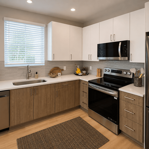 A modern kitchen with wooden cabinets and stainless steel appliances.