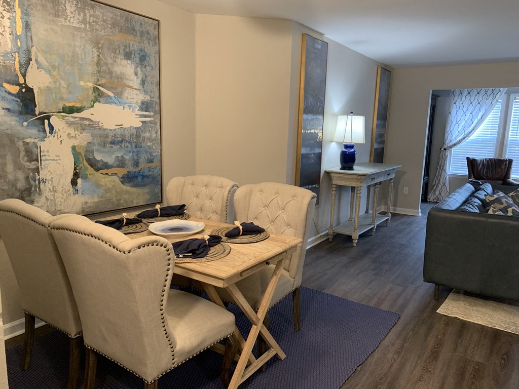 Compass dining area with dinette set, living room in background