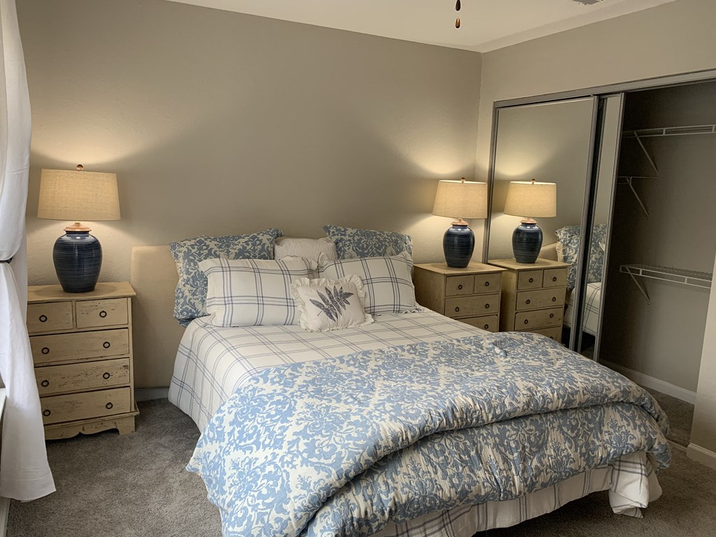 Compass guest bedroom with bed and dressers