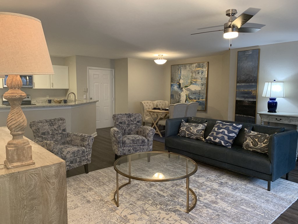 Compass living room with couch and chairs