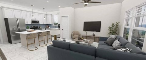 A modern living room with a grey couch and a kitchen area in the background.