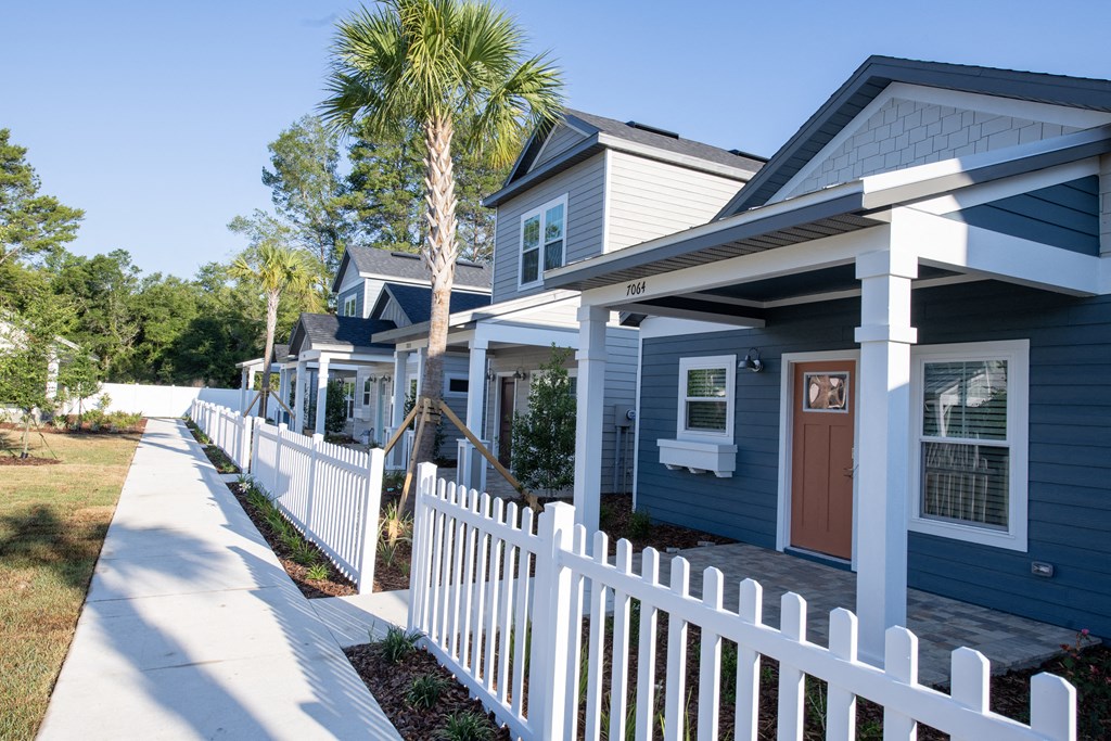 exterior of cottages with white picket fences
