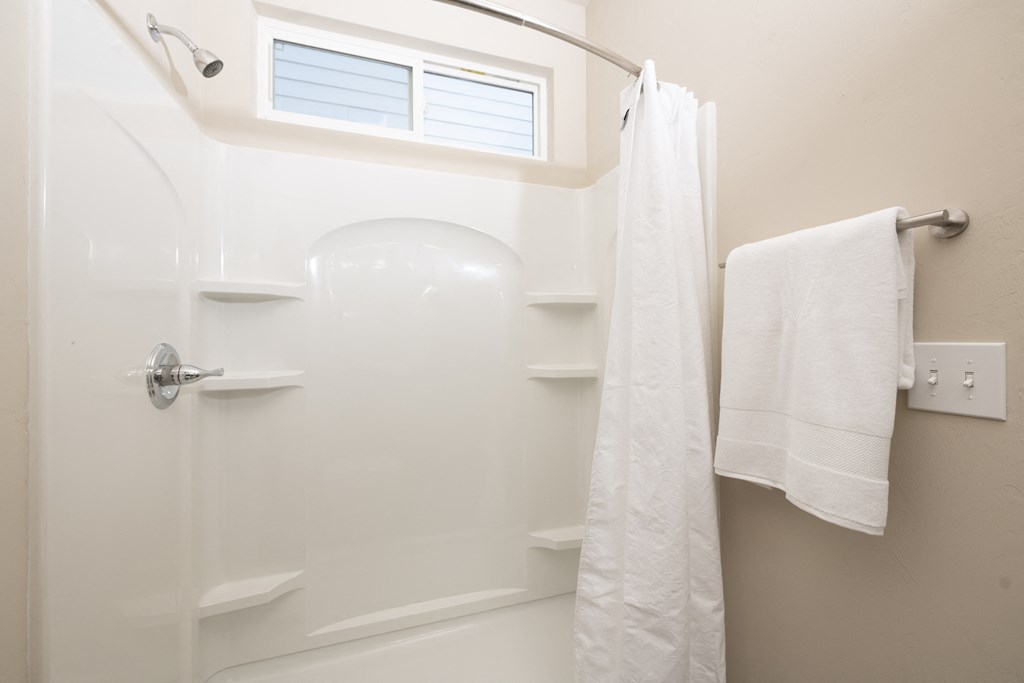 shower stall with tub and curved shower rod