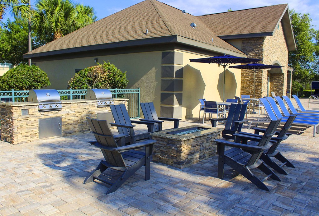 Pool and grill with clubhouse in background