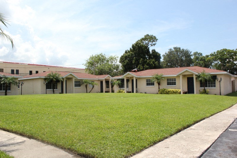a house with a large lawn in front of it