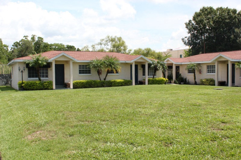 a house with a large lawn in front of it