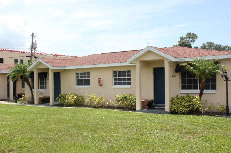 a house with a lawn in front of it