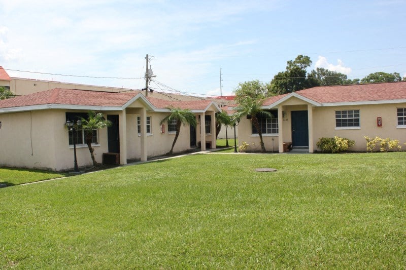 a yard in front of a house with a grassy yard