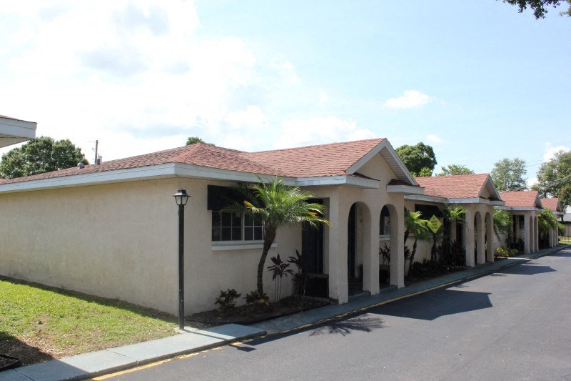 a house with a palm tree in front of it