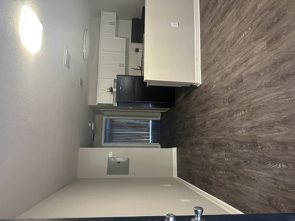 a small bathroom with a sink and a microwave in it