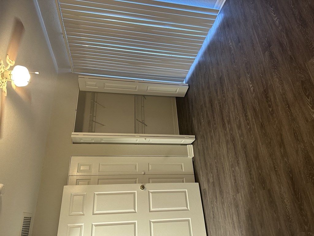 a look down at the bottom of a closet with a skylight above it