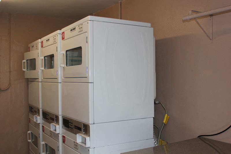 a white refrigerator freezer sitting in a room