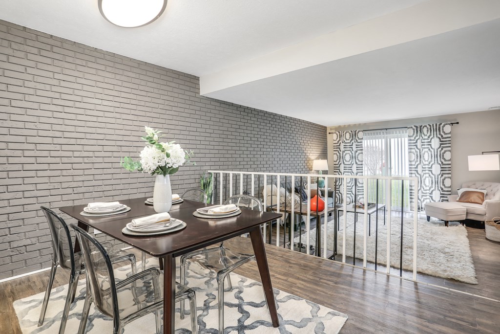 a dining room with a table and chairs