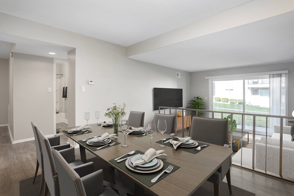 a dining room with a large wooden table and chairs