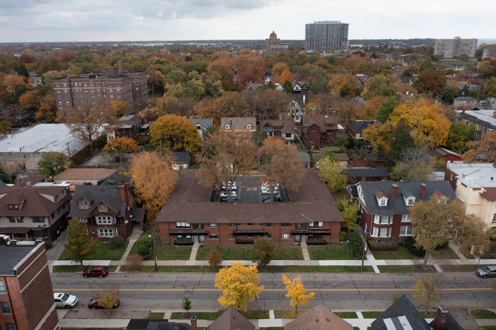 an aerial view of a neighborhood with houses and trees