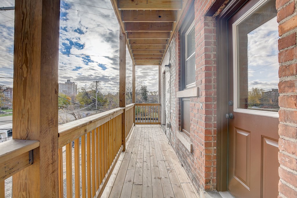 a back porch with light colored wood