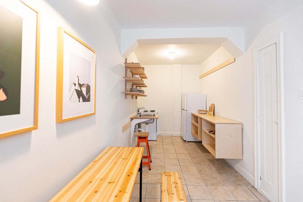 kitchen with white walls and storage