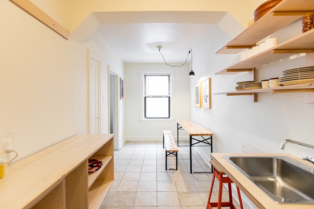 kitchen with white walls and storage