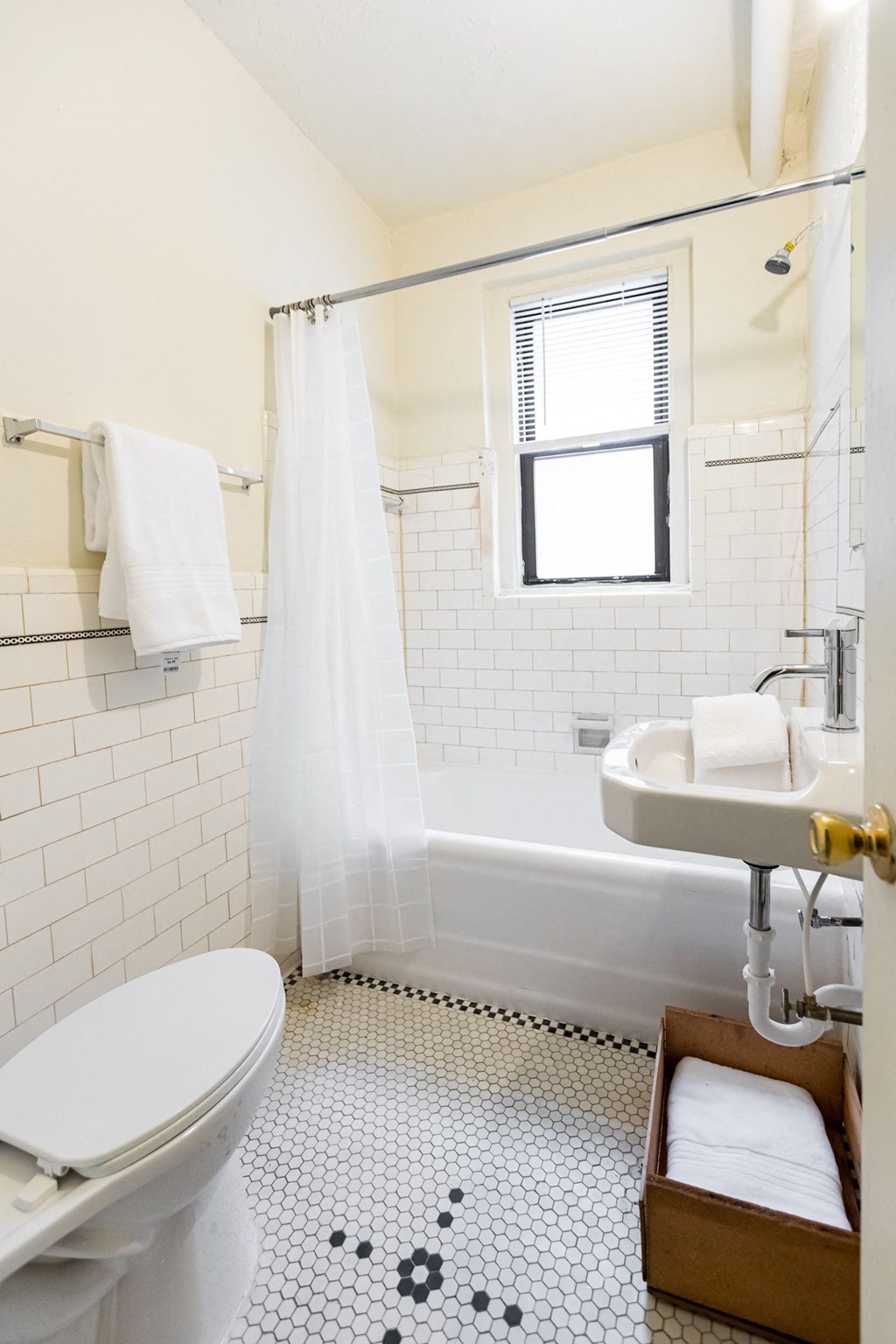 bathroom with white walls and white tile