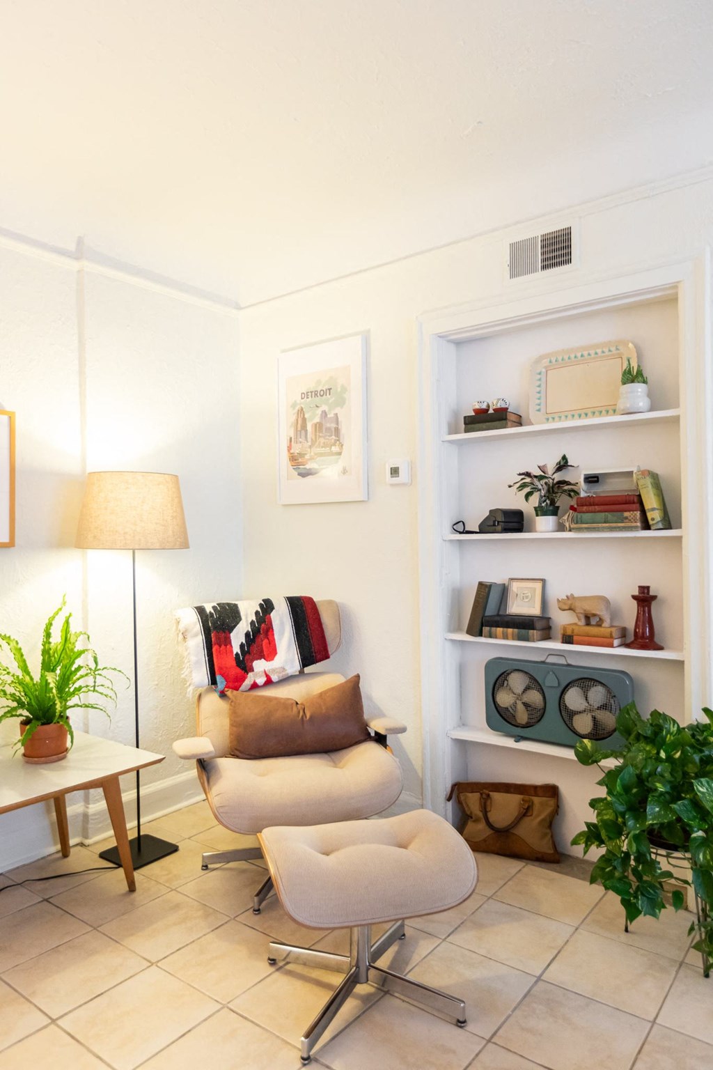 a living room with a chair and a table