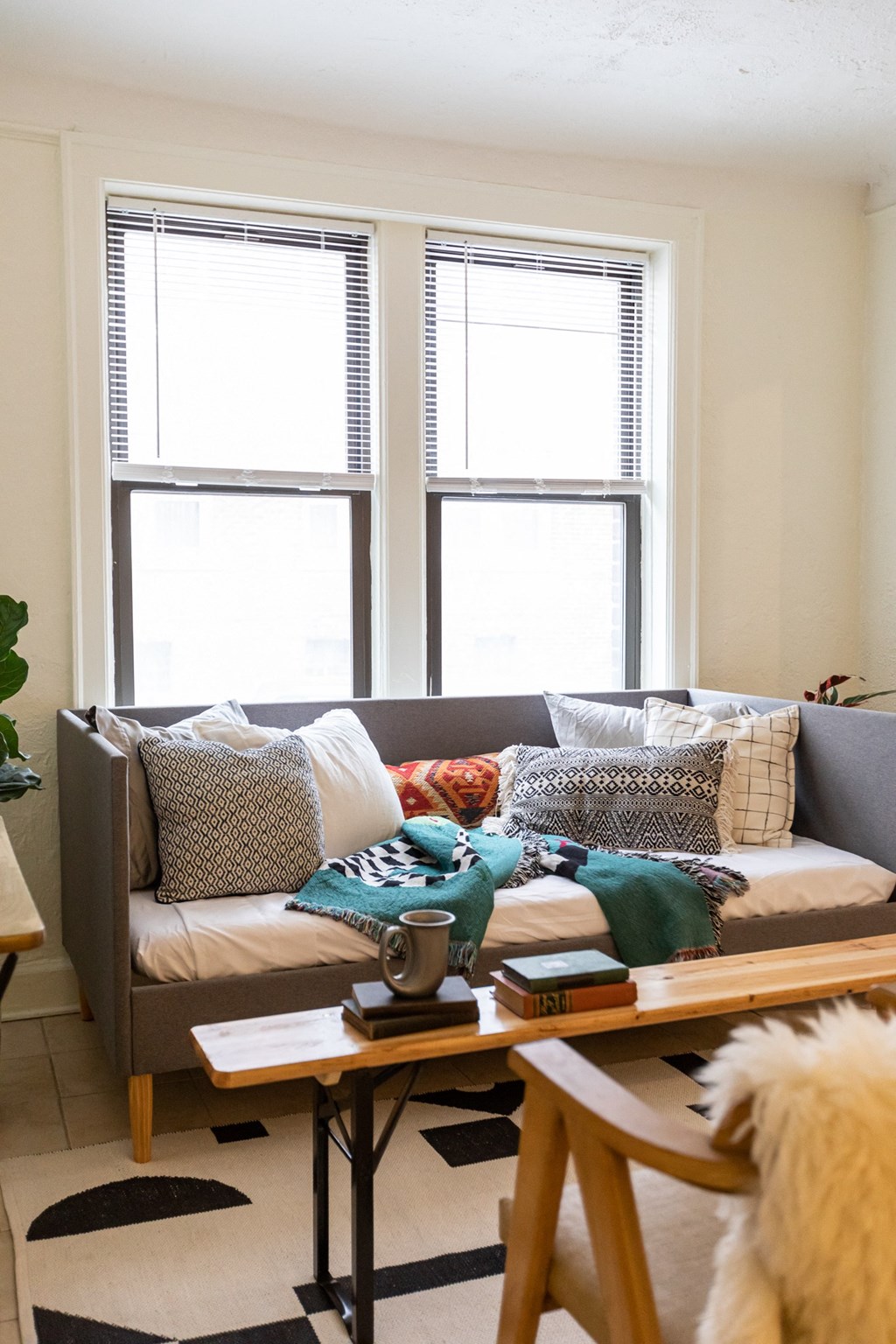 living room with white walls, window and couch