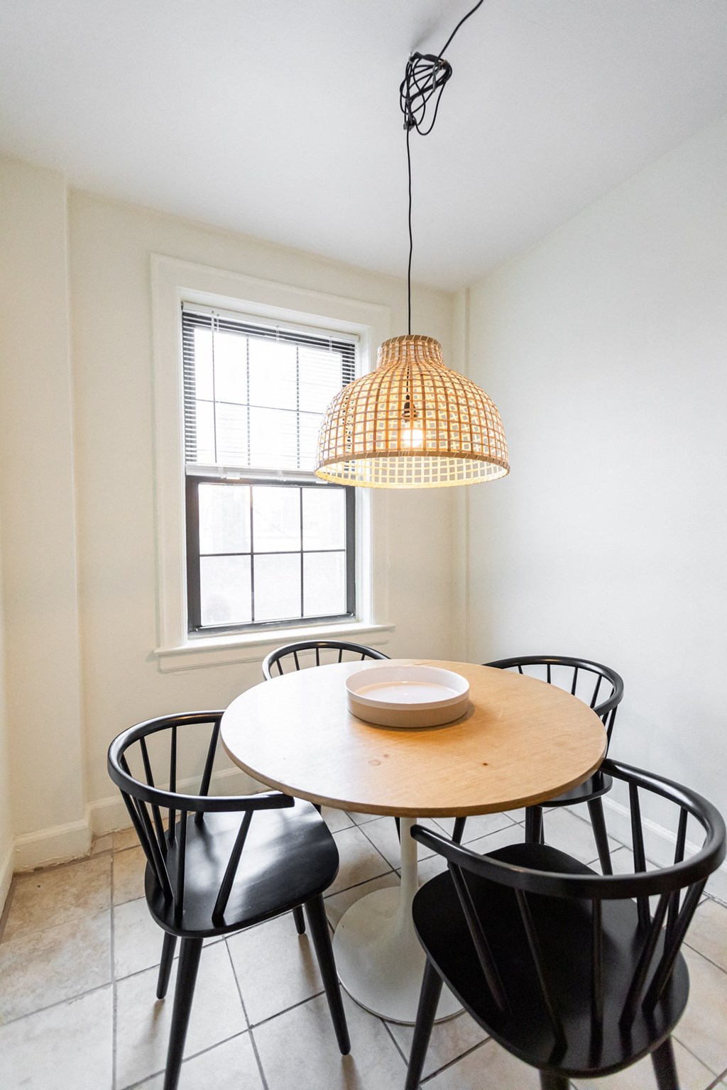 kitchen with white walls and tile and kitchen table
