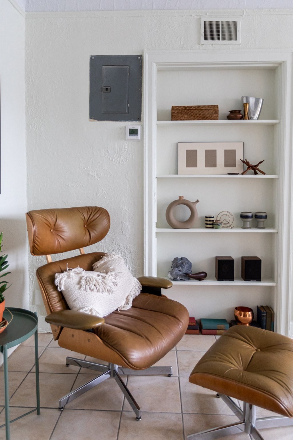 living room with book shelf and lounge chair