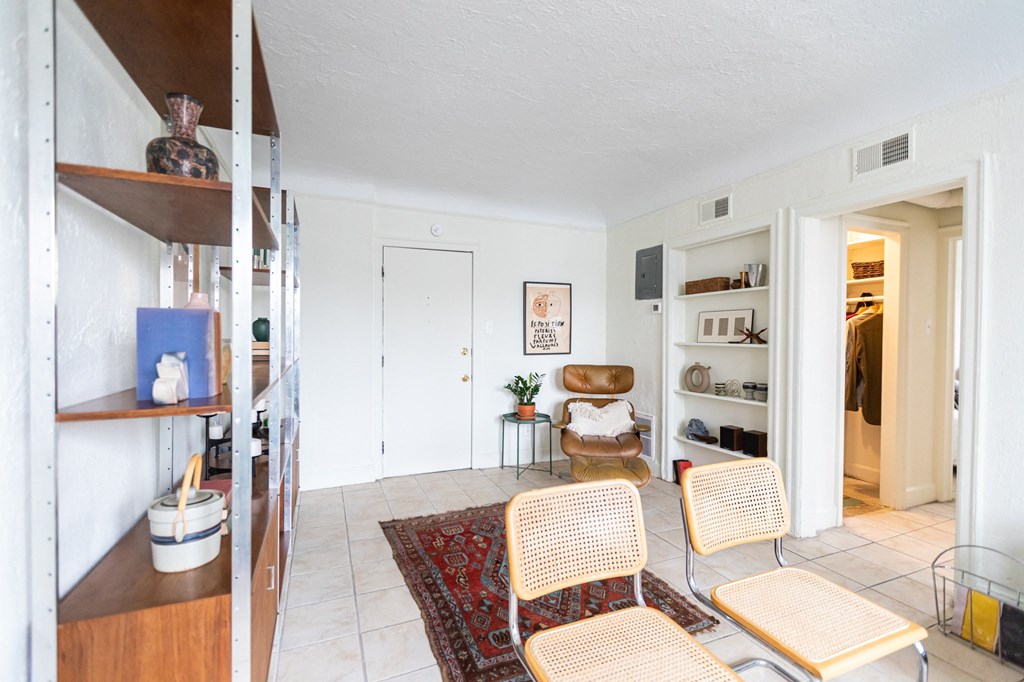 living area with tan chairs