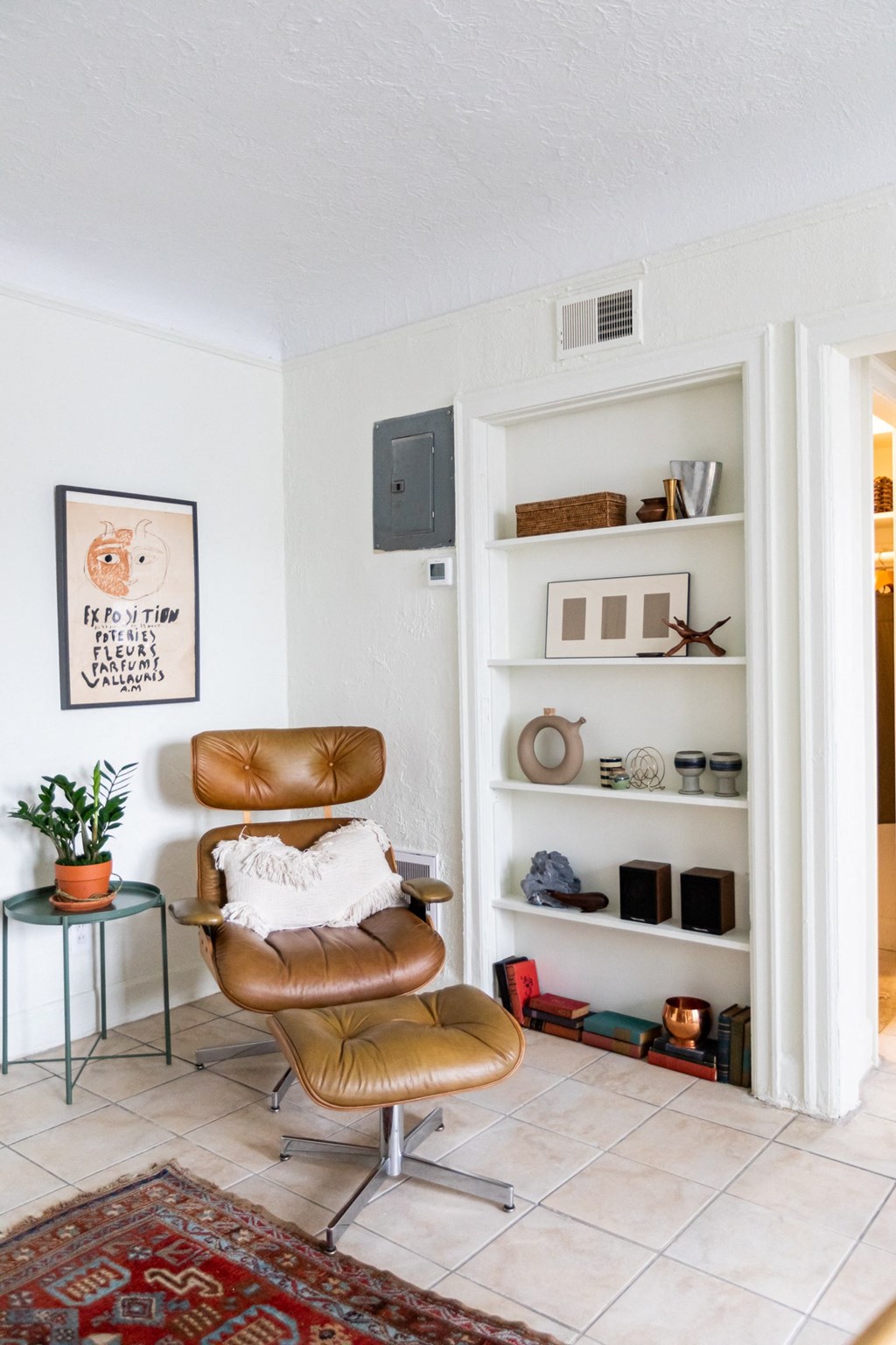 living room with white walls and lounge chair