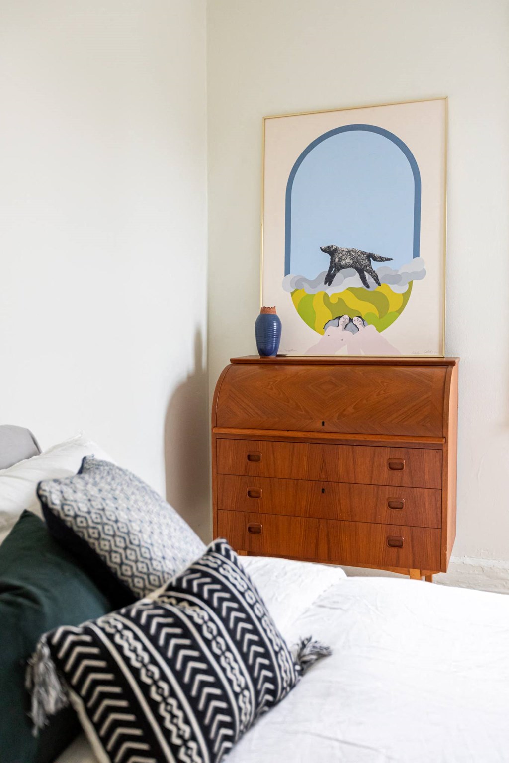 bedroom with white walls and dresser