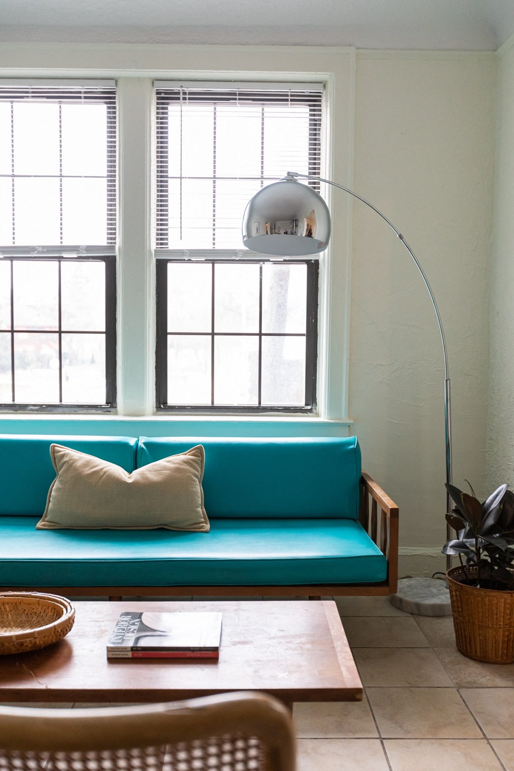 living room with lamp, window, and couch