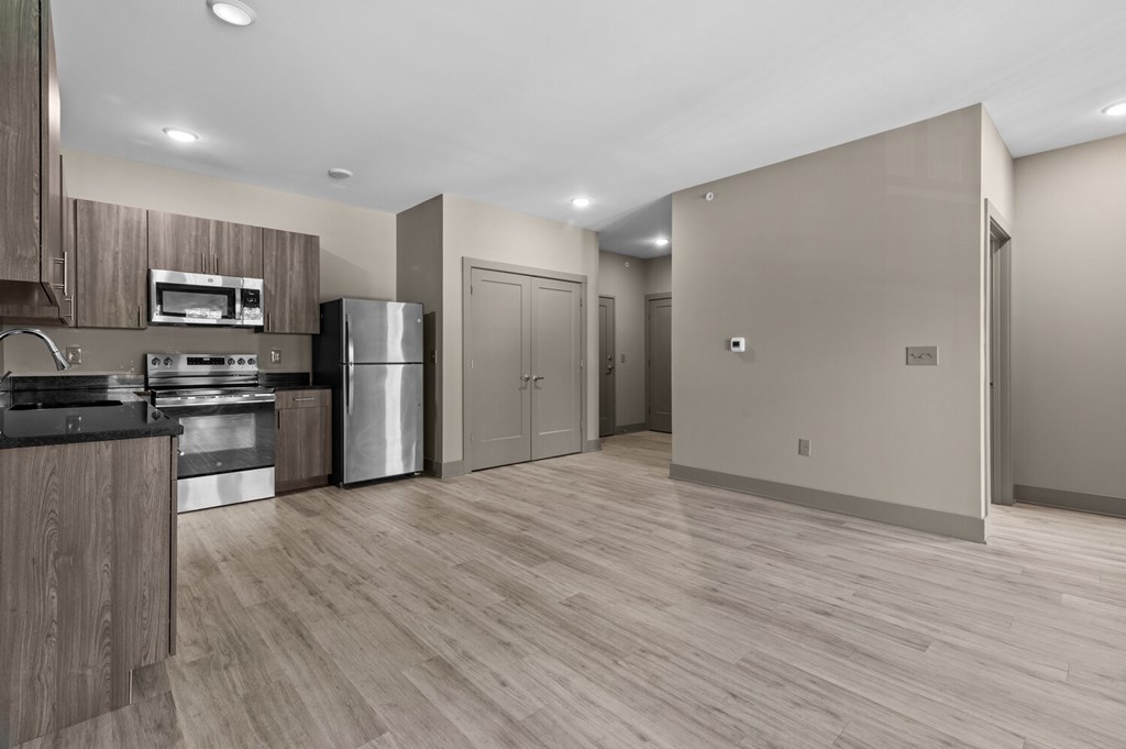 A kitchen with wooden cabinets and stainless steel appliances.