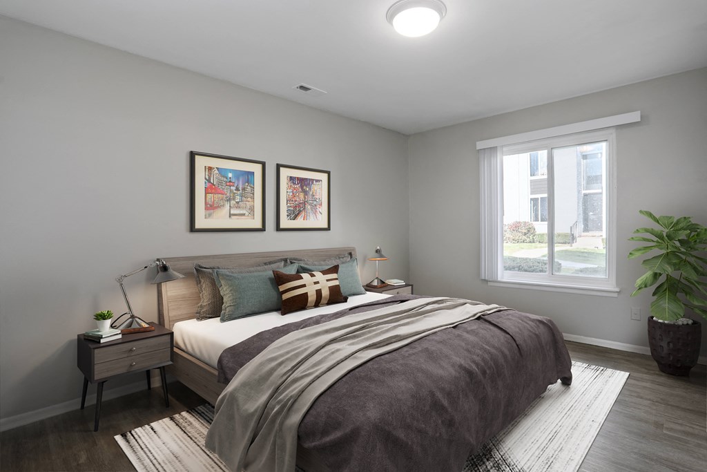 a bedroom with a bed and a window