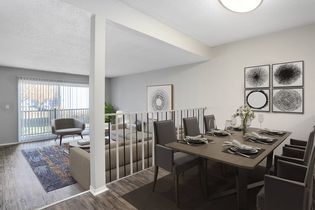 an open living room and dining room with a table and chairs