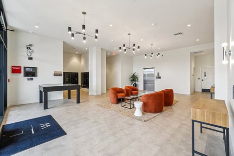 A modern living room with a pool table and a TV.