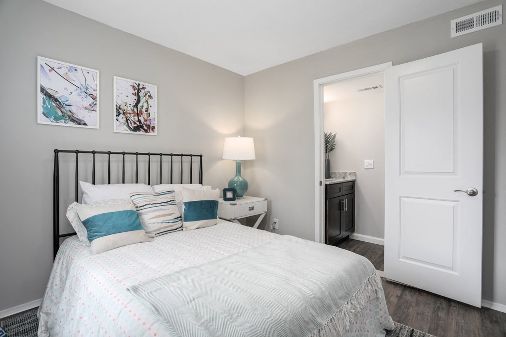 a bedroom with a bed and a closet