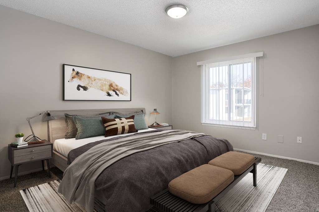 an overview of a bedroom with a bed and a window