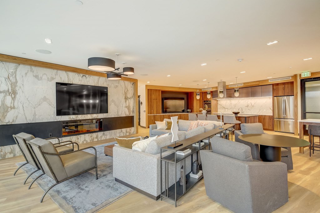 a living room with couches and chairs and a table