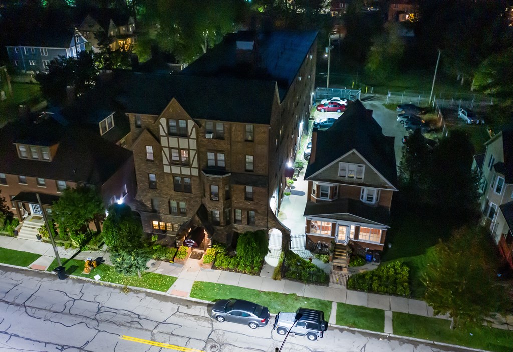 an aerial view of an apartment building at night