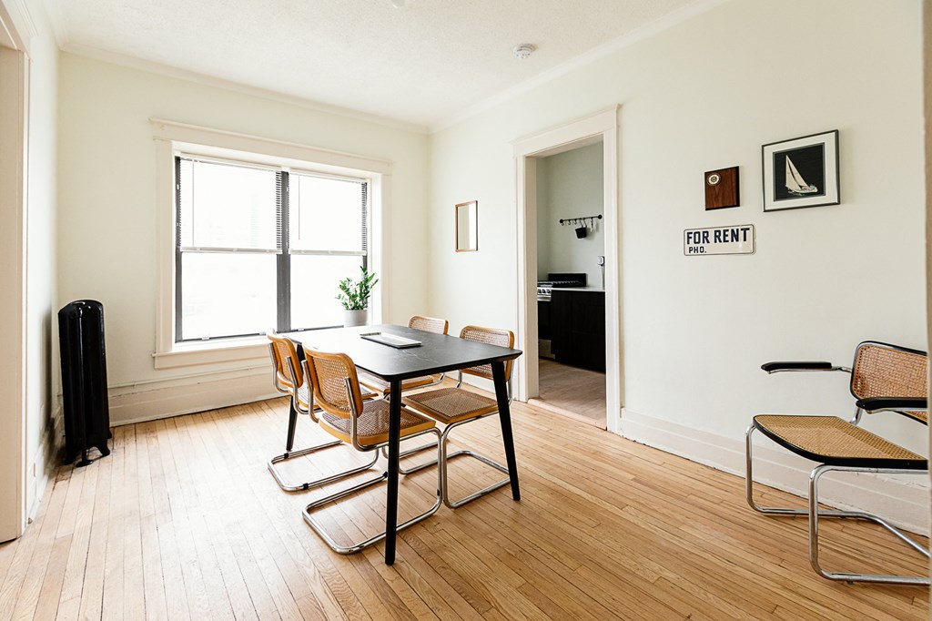 a dining room with a table and chairs