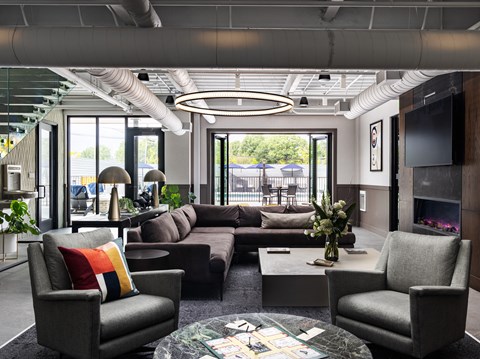 A modern living room with a grey sofa set and a coffee table.