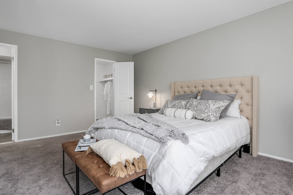 a bedroom with a large bed and a table