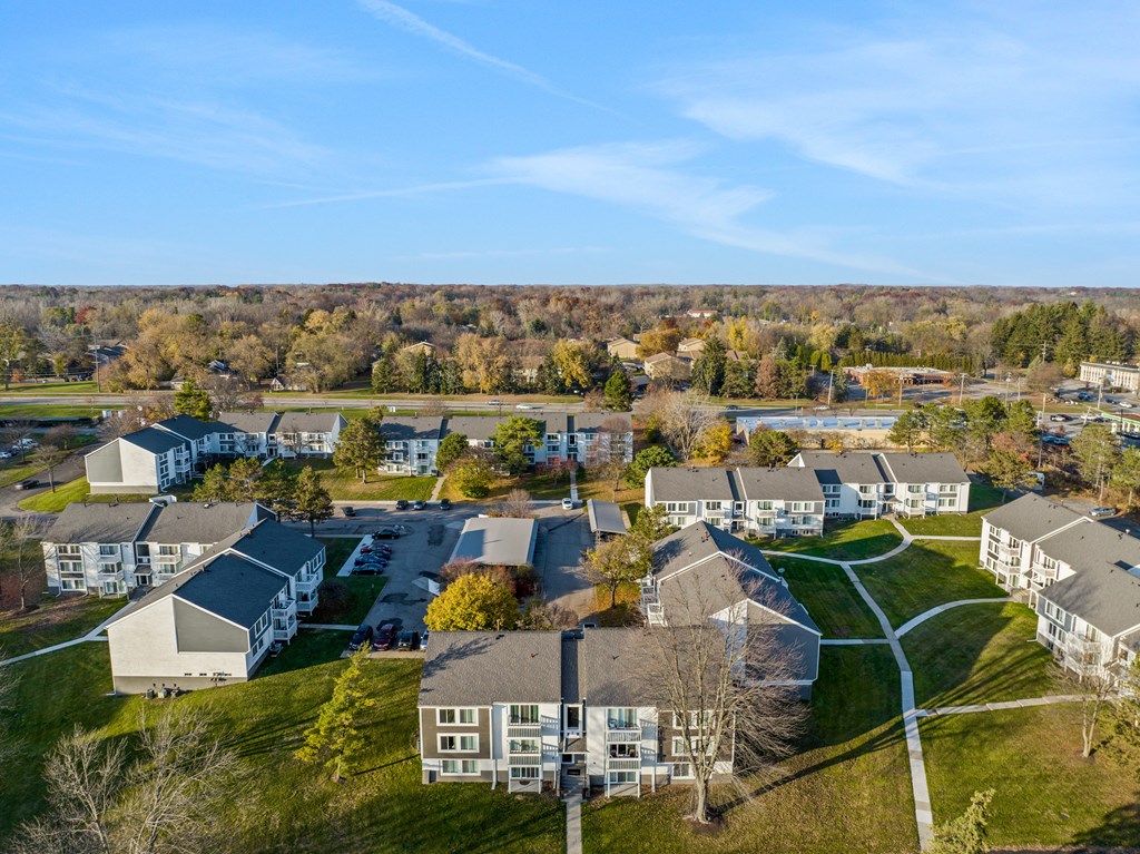 an aerial view of a neighborhood with houses and trees