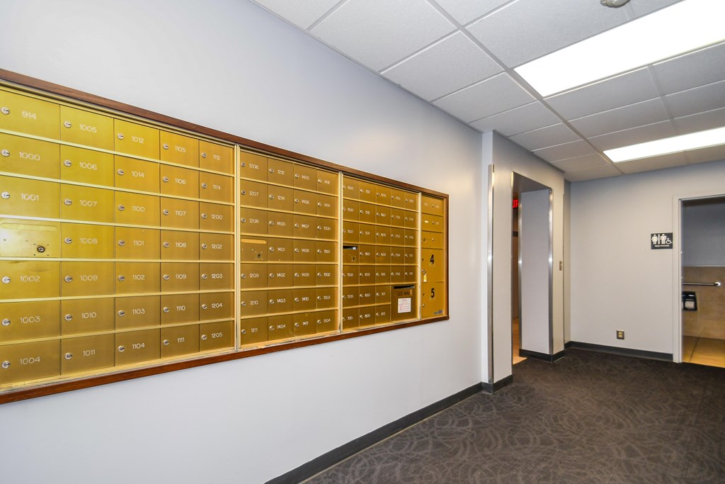A wall of mailboxes with the numbers 1004 to 1011.