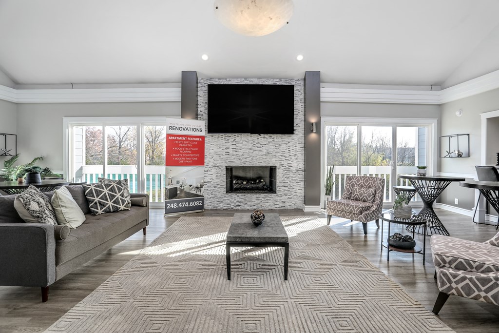 a living room with a fireplace and a television