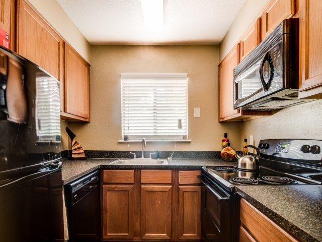 a kitchen with a stove and a sink