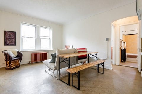 a living room with a dining table and a couch