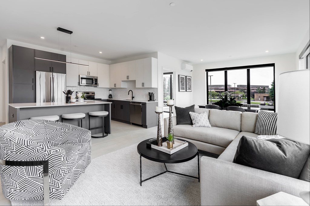 large living room dining room and kitchen area with an island