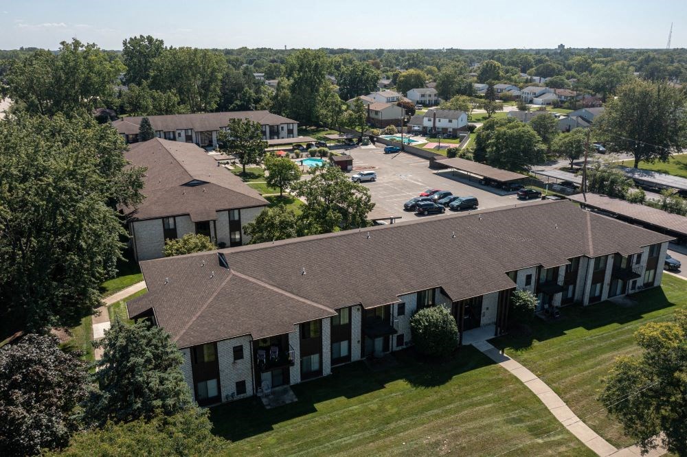 arial view of a building with a brown roof